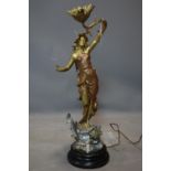 An early 20th century French spelter lamp of a lady on a fish, H.68cm