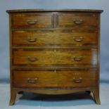 An early 19th century mahogany cross banded bow front chest of drawers, H.106 W.107 D.57cm