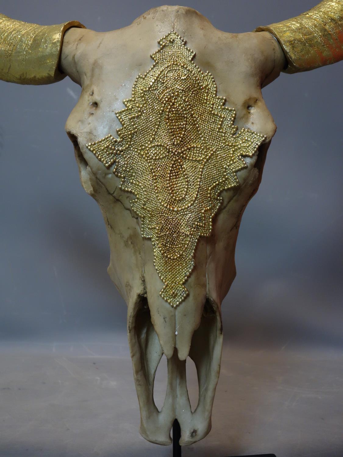 A faux bison skull with gilt painted horns, on stand, H.72 W.78cm - Image 2 of 3