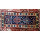 A Northwest Persian Malayer rug, repeating stylised eagle motif design on a sapphire field, within