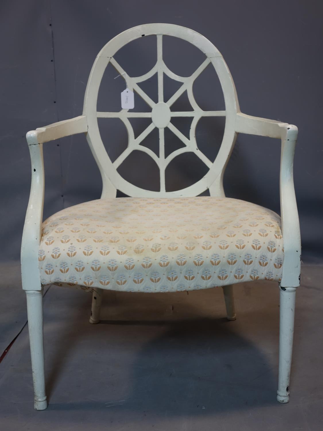 A 19th century Hepplewhite style armchair, painted white