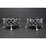 A pair of George III silver mustard pots by James McKay, Edinburgh 1812, with pierced scrolling