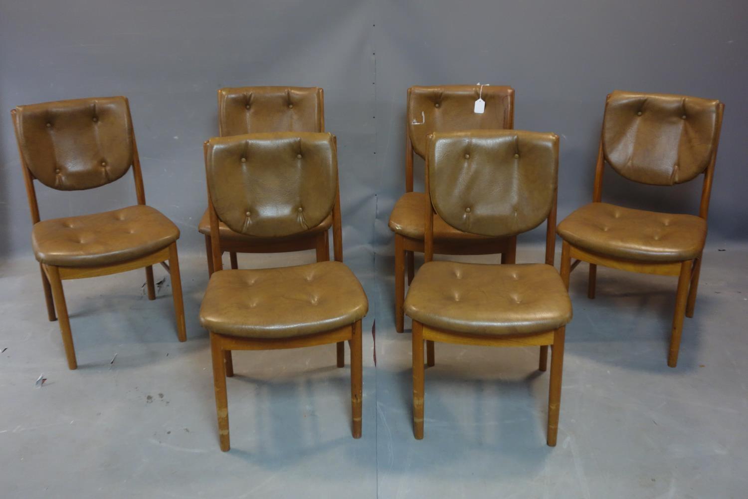 A set of six 20th century teak dining chairs