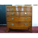 A Regency mahogany bow fronted chest of drawers, raised on splayed feet, H.104 W.102 D.49cm