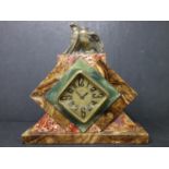 A French Art Deco marble on onyx mantle alarm clock by DEP, c.1930s, with diamond shaped dial with
