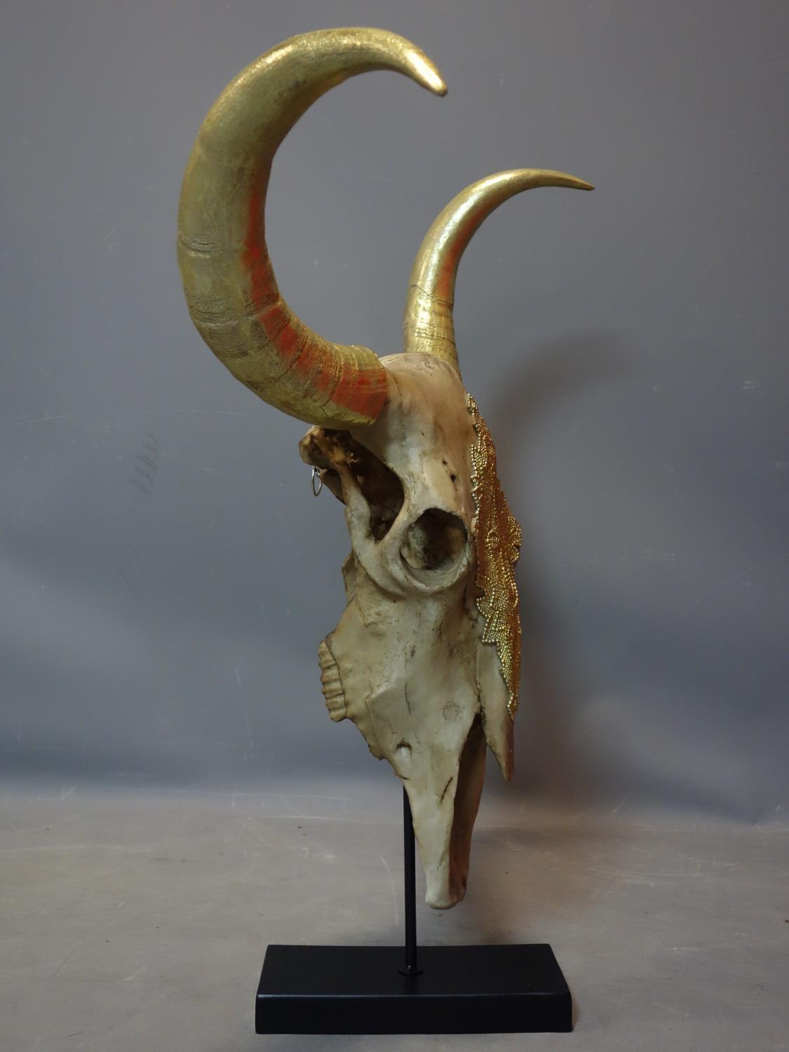 A faux bison skull with gilt painted horns, on stand, H.72 W.78cm - Image 3 of 3