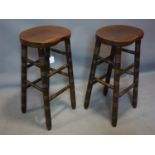 A pair of solid Oak bar Stools, with saddle seats