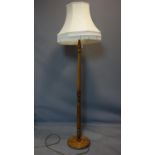 A vintage oak standard lamp, with shade, H.168cm