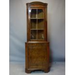 A burr walnut corner cabinet, H.185 W.65 D.35cm