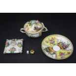 A 19th century Meissen porcelain twin handled bowl and dish, handpainted with vignettes of couples