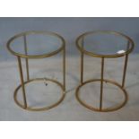 A pair of gilt metal circular lamp tables with glass tops, H.46 D.40cm