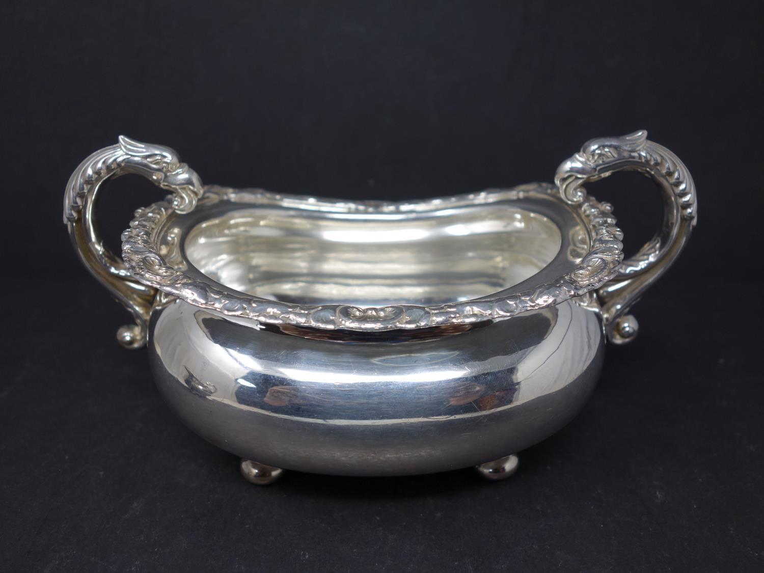 A silver cream jug with twin dragon head handles and shell and flower rims, hallmarked London, - Image 2 of 5