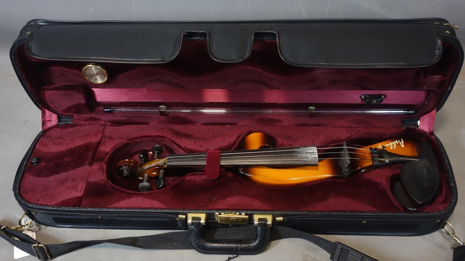 An Ashbury electric violin with carry case