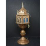 A Middle Eastern copper lamp, H.38cm