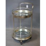 An Art Deco style trolley with mirrored tiers, raised on castors, H.77 W.40 D.45cm