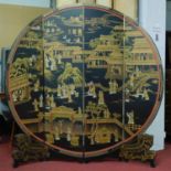 A Chinese black lacquered circular four fold room screen, decorated with figures in palace scenes,