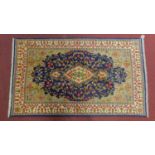A Central Persian Kirman rug, central double pendant medallion with repeating petal motifs on a