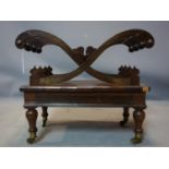 A late Regency rosewood Canterbury X-frame design, with drawer, raised on turned legs and castors,