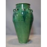 A Persian green glazed Sharab wine vessel, H.77cm