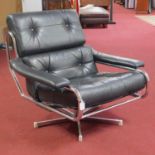 A vintage Pieff chrome and leather swivel armchair, with rubber webbing