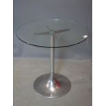 A vintage Circular glass topped table, raised on chrome base, H.73 D.76cm