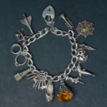 A silver charm bracelet with assorted charms, some marked 925, gross weight approx. 55.4g