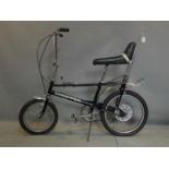 A black vintage Raleigh Chopper MK1, with Sturmey Archer 3 speed gears