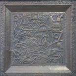 An Oriental brass panel, repousse decorated with a map of a town with temples and gardens, framed,