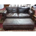 A Fishpools leather sofa together with matching foot stool