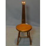 A mahogany musicians chair, the seat and backrest in the shape of a lute and the legs in the form of