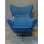 An Arne Jacobson Swan style armchair with blue upholstery, H.112 W.84 D.75cm