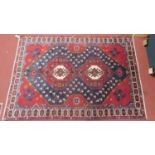 A Northwest Persian Bakhtiari carpet, double pole medallion with repeating floral motifs on a