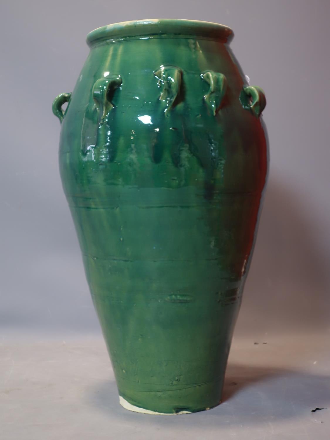 A Persian green glazed Sharab wine vessel, H.74cm