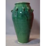 A Persian green glazed Sharab wine vessel, H.74cm