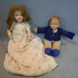 An antique French porcelain doll stamped SFBJ Paris, head restored, together with another doll
