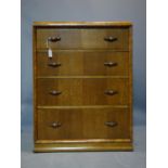 An oak and walnut chest of four drawers, on plinth base, H.33 W.71 D.46cm