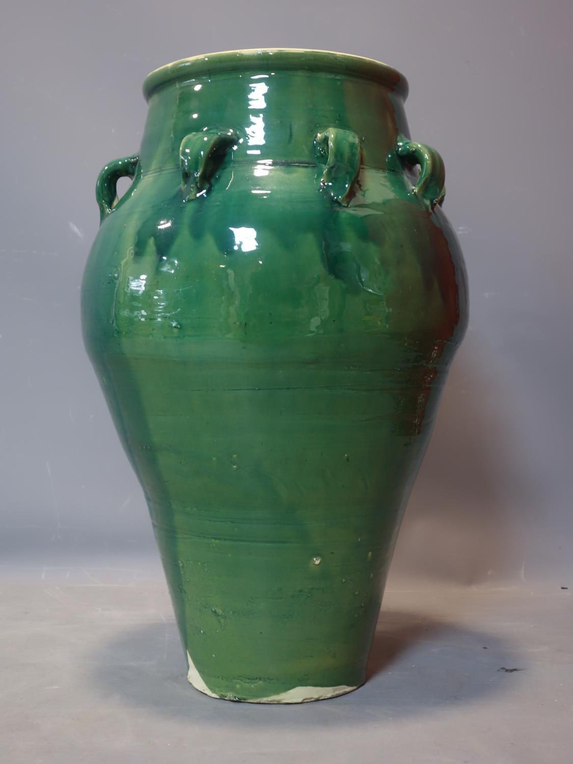 A Persian green glazed Sharab wine vessel, H.70cm