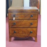 A Regency mahogany chest of three drawers, the cross-banded top above front with parquetry inlay and