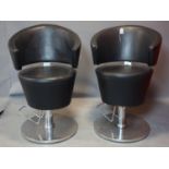 A pair of Vintage barber's chairs on chrome bases H - 95 cm