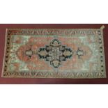 A Northwest Persian Heriz rug, central diamond medallion with repeating geometric motifs on a