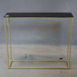 A contemporary gilt metal console table with black painted wooden top, H.70 W.80 D.20cm