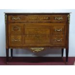 An Empire style chest of three drawers with marble top and marquetry inlaid decoration, ormolu