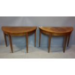 A pair of 19th century mahogany demi lume console tables, raised on tapered legs, H.72 W.110 D.52cm