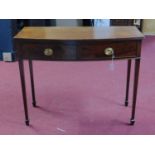 A mahogany bowfronted two drawer side table, on square tapered legs with spade feet, H.78 W.98 D.