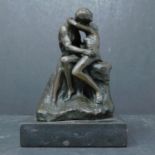 A reproduction bronze of Rodin's 'The Kiss', H.15cm