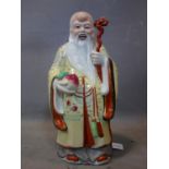 A large Chinese Republican period figure of Shou Lao, the God of Longevity, holding a staff and a