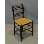 A William Morris style chair with rush seat, H.82cm