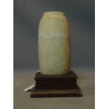 An Eygptian alabaster vase, on stepped square base, H.35cm