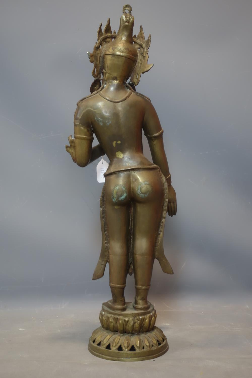 A Southeast Asian brass figure of a female deity on a lotus base, H.78cm - Image 4 of 4