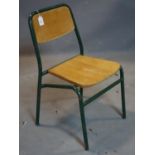 A vintage green painted metal school chair, stamped 'Neeta LFD 1968 'Greater London Council'